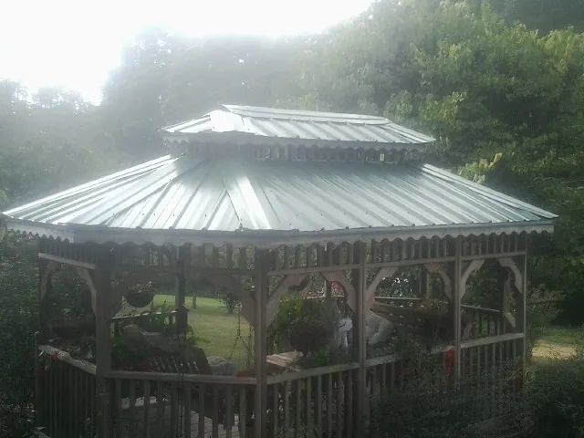 Two tier green metal roof on a garden gazebo in Meridian